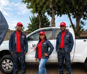 Lukhanyo M Projects team with company vehicle